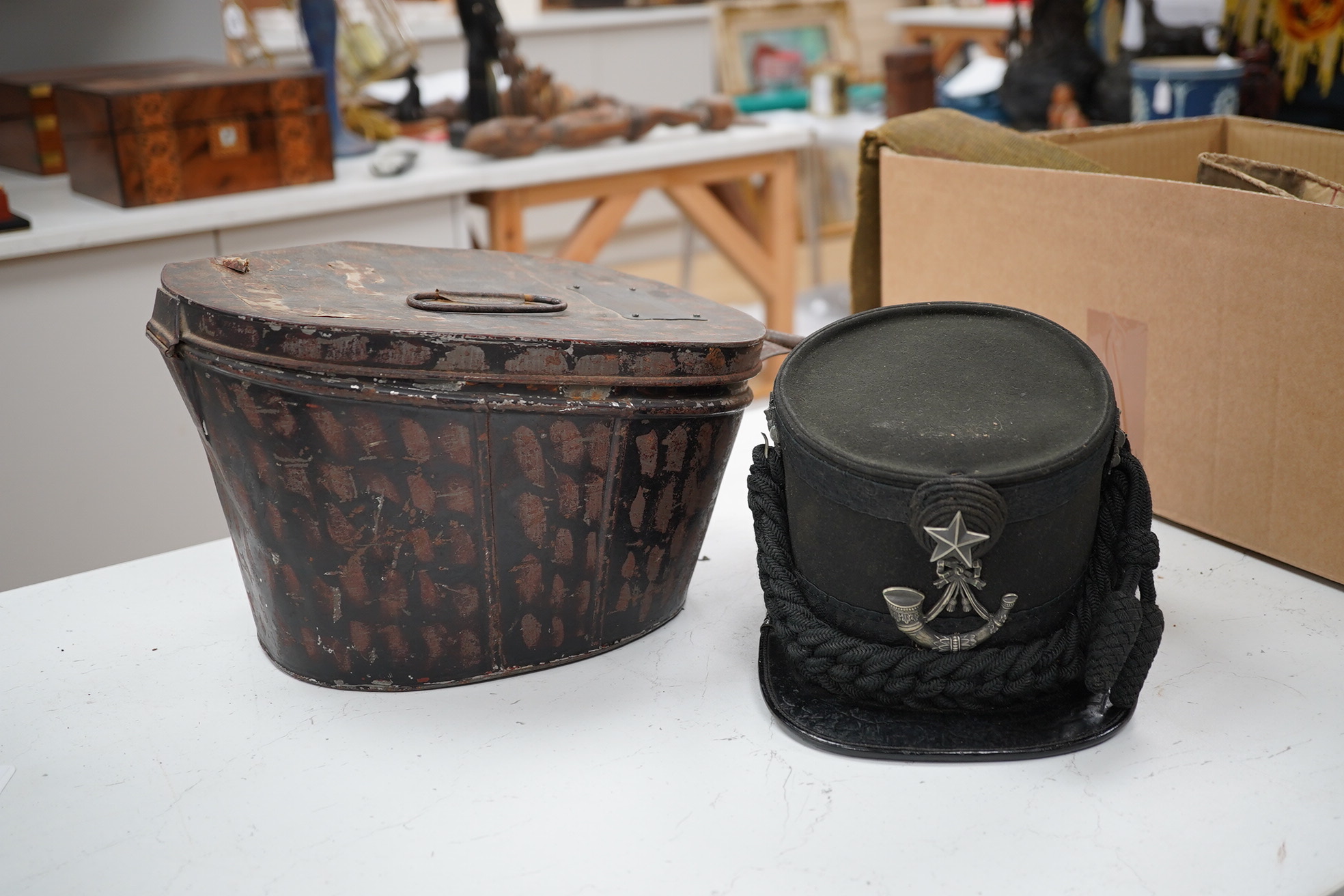 A Victorian tin cased Scottish Rifles officer's shako by Cater & Co. Pall Mall, London, with cap badge for the Cameronians, Applied plaque to lid engraved R. Robertson Esq. 2nd Scottish Rifles. Condition - fair to good,